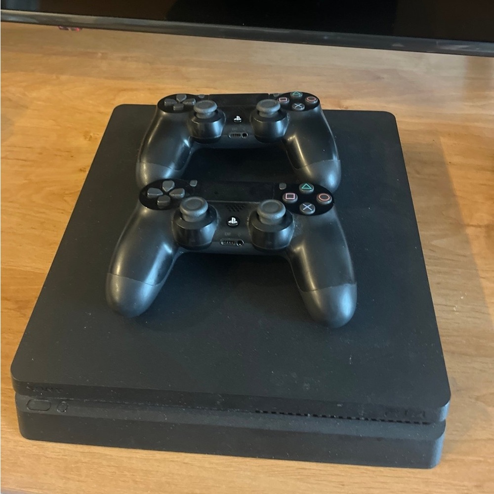 Used Black PS4 Slim with 2 Remotes